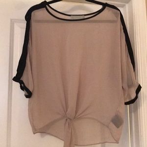 Sheer tan blouse with black lining